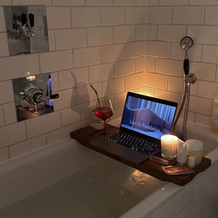 Relaxing bath with candles and a mocktail